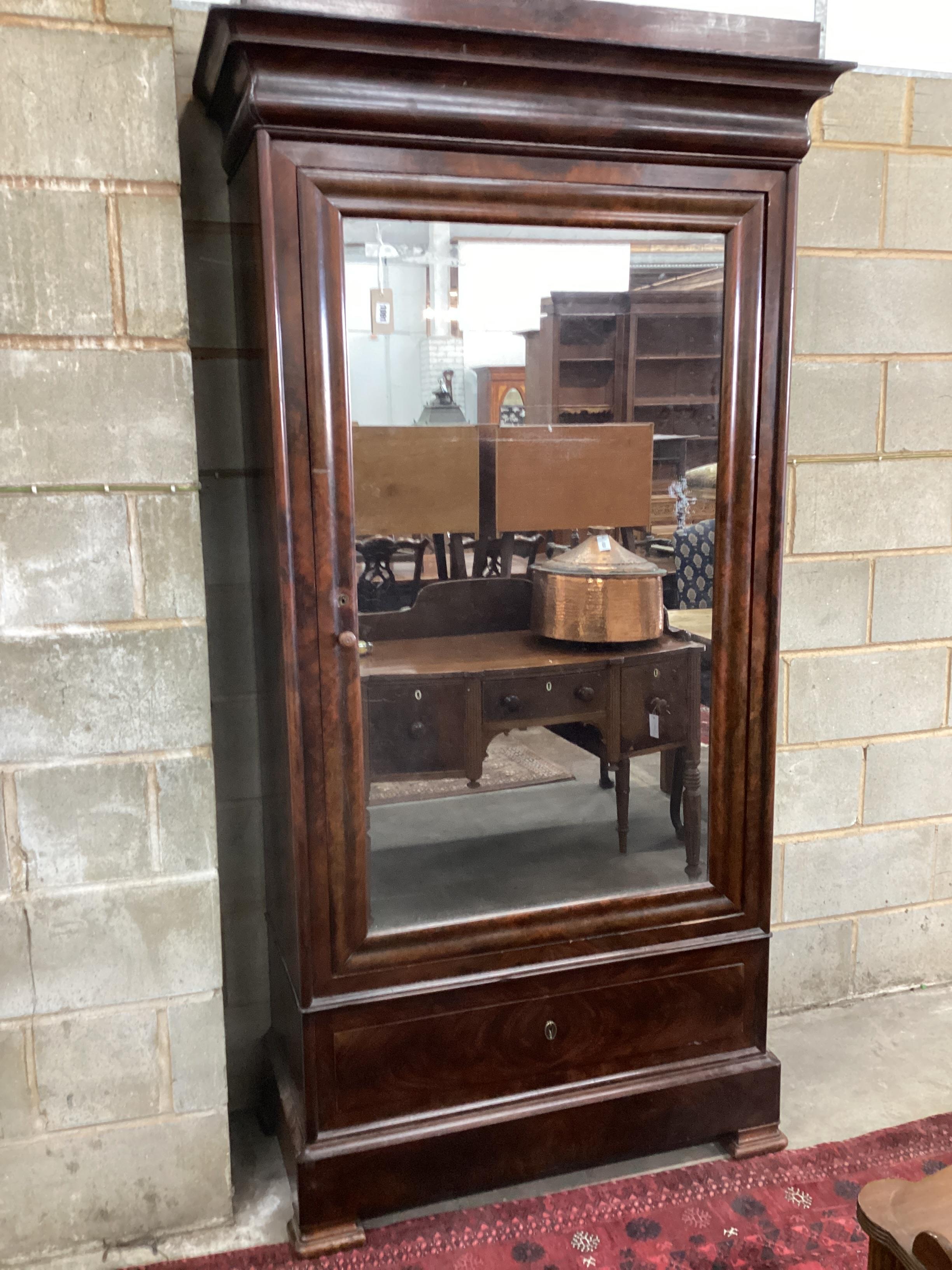 A mid 19th century French mahogany mirrored armoire width 108cm, depth 51cm, height 214cm.